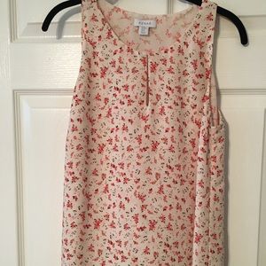 Sleeveless, floral top.